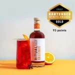 Ritual Zero Proof Rum Alternative bottle with a red cocktail, awarded 'Gold' by 2022 Bartender Spirits Awards with 93 points.