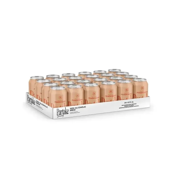 Tray of Trapl beer cans neatly arranged, highlighting bulk packaging for non-alcoholic craft beer.