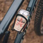 First Ride non-alcoholic coffee-infused beer can placed in a bike holder, perfect for enjoying a refreshing drink during outdoor adventures.