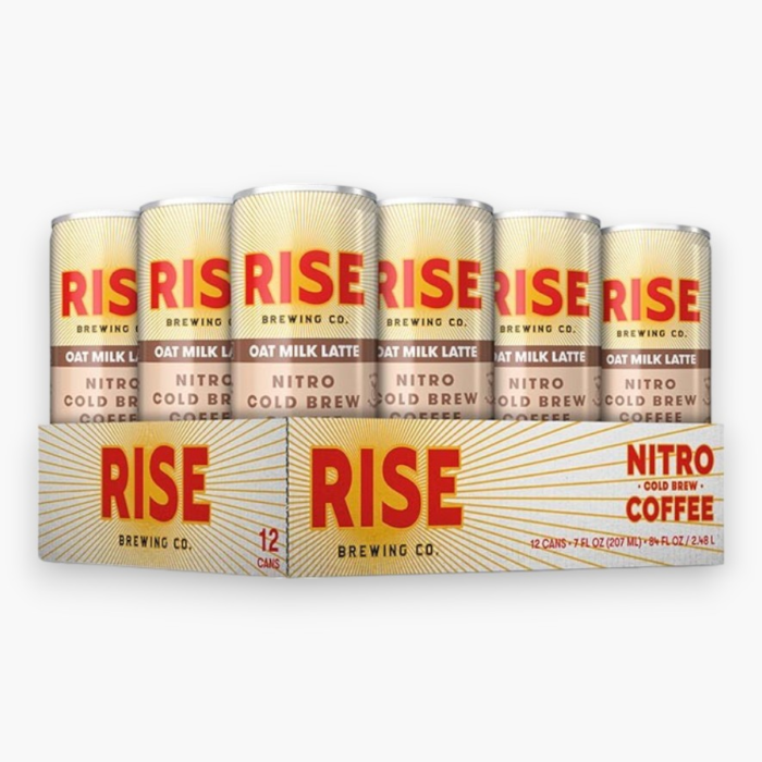 Rise Nitro Cold Brew Oat Milk Latte can with splashes of creamy coffee against a white background.