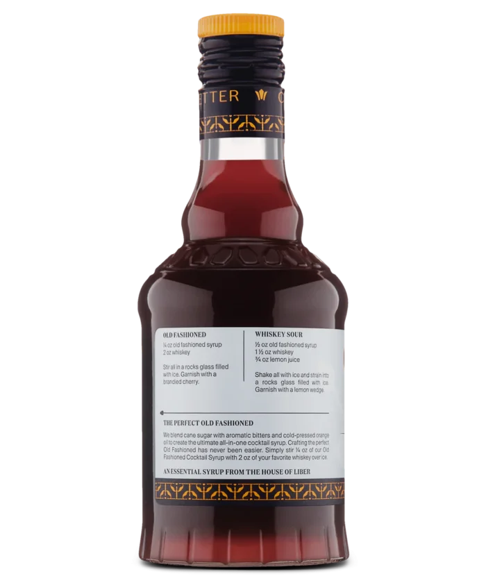 Close-up of red liquor bottle's back label featuring detailed text on a white background.