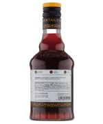 Rear view of a red liquor bottle with white label displaying product details and barcode.