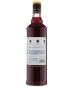 Rear view of red liquor bottle displaying detailed product instructions on a white label.