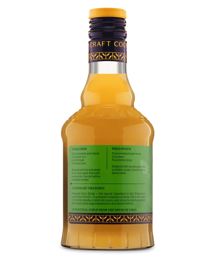 Glass bottle with green label and yellow liquid, perfect for beverages or culinary use.