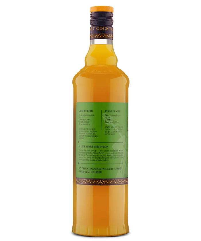 Side view of a tall glass bottle with green label and yellow liquid, perfect for beverages or cocktails.