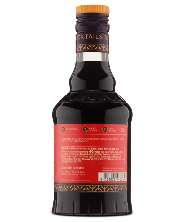 Close-up of a dark liquor bottle's back label with text on a vibrant red background.