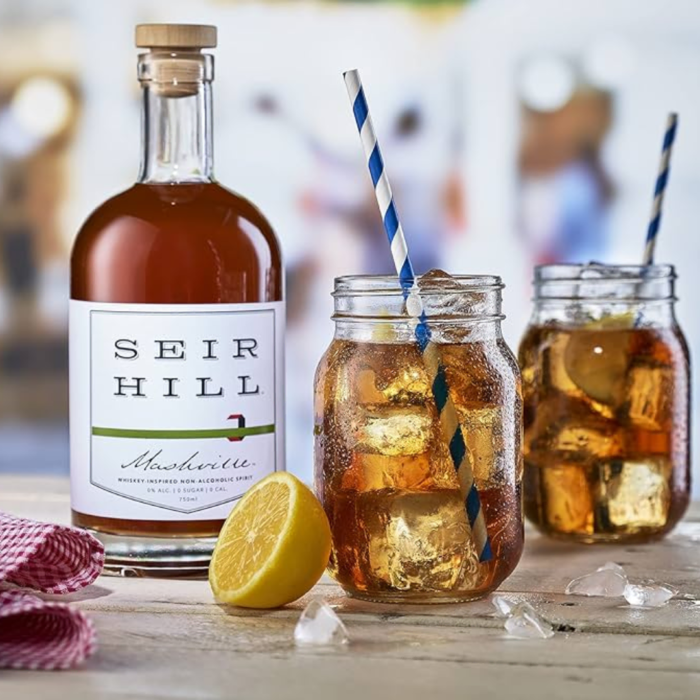 Seir Hill Mashville non-alcoholic spirit bottle with iced whiskey mocktails and lemon garnish.