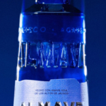 Almave Azul: An elegant close-up of the blue agave spirit bottle, highlighting its intricate details
