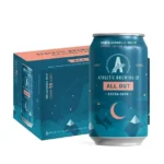 6-pack of Athletic Brewing Co.'s All Out Extra Dark non-alcoholic beer, featuring bold packaging with a moonlit mountain design and 90 calories per can.