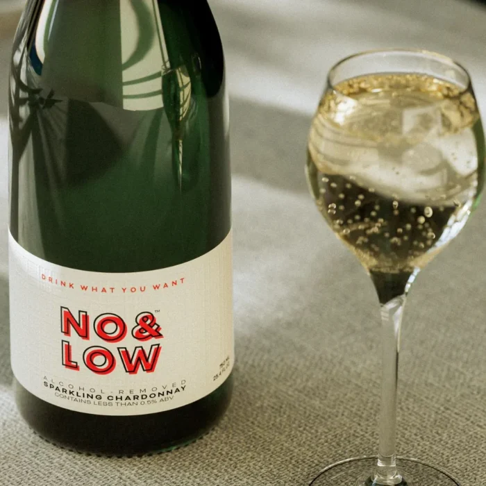 No & Low sparkling wine bottle with a filled glass, showcasing low-alcohol elegance.