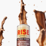 Rise Nitro Oat Milk Mocha can with splashes of creamy mocha against a white background.