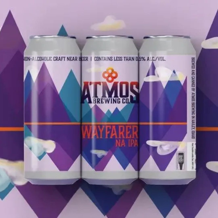 Atmos Brewing Co. Wayfarer NA IPA: A dynamic and colorful mountain-inspired design emphasizing exploration and adventure, perfect for craft beer enthusiasts seeking a non-alcoholic IPA with bold flavors.