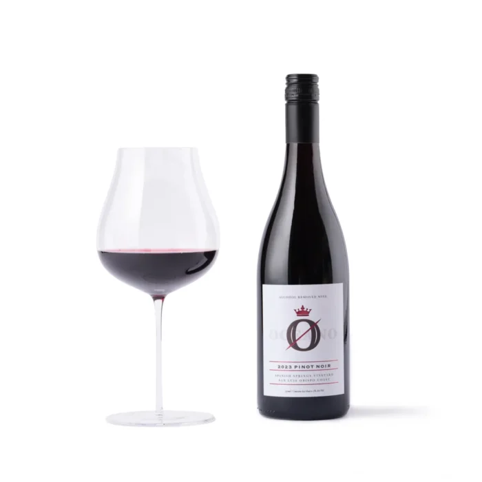 Bottle of 2023 Pinot Noir with a filled wine glass, set against a clean white background.